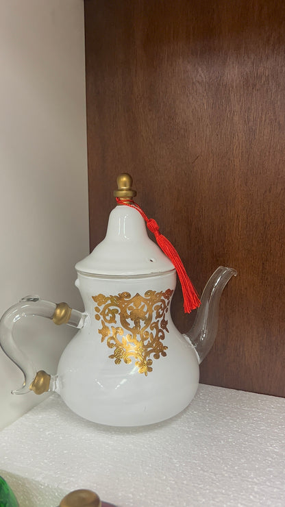 Théière en verre élégante avec motif floral doré
