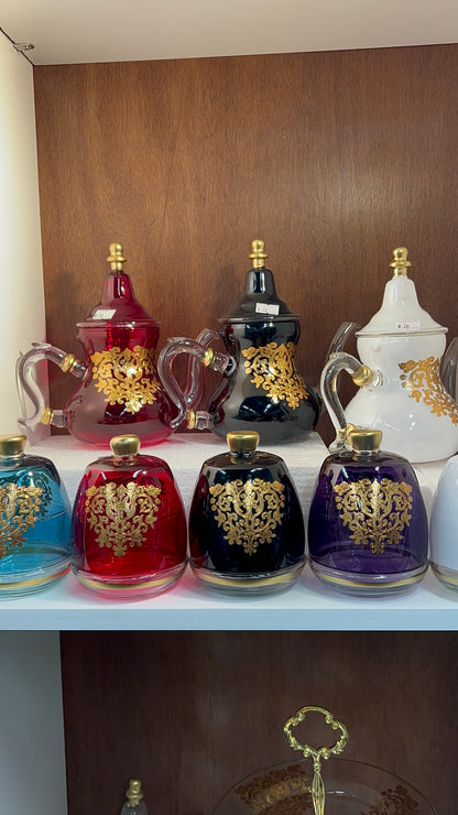 Théière en verre élégante avec motif floral doré